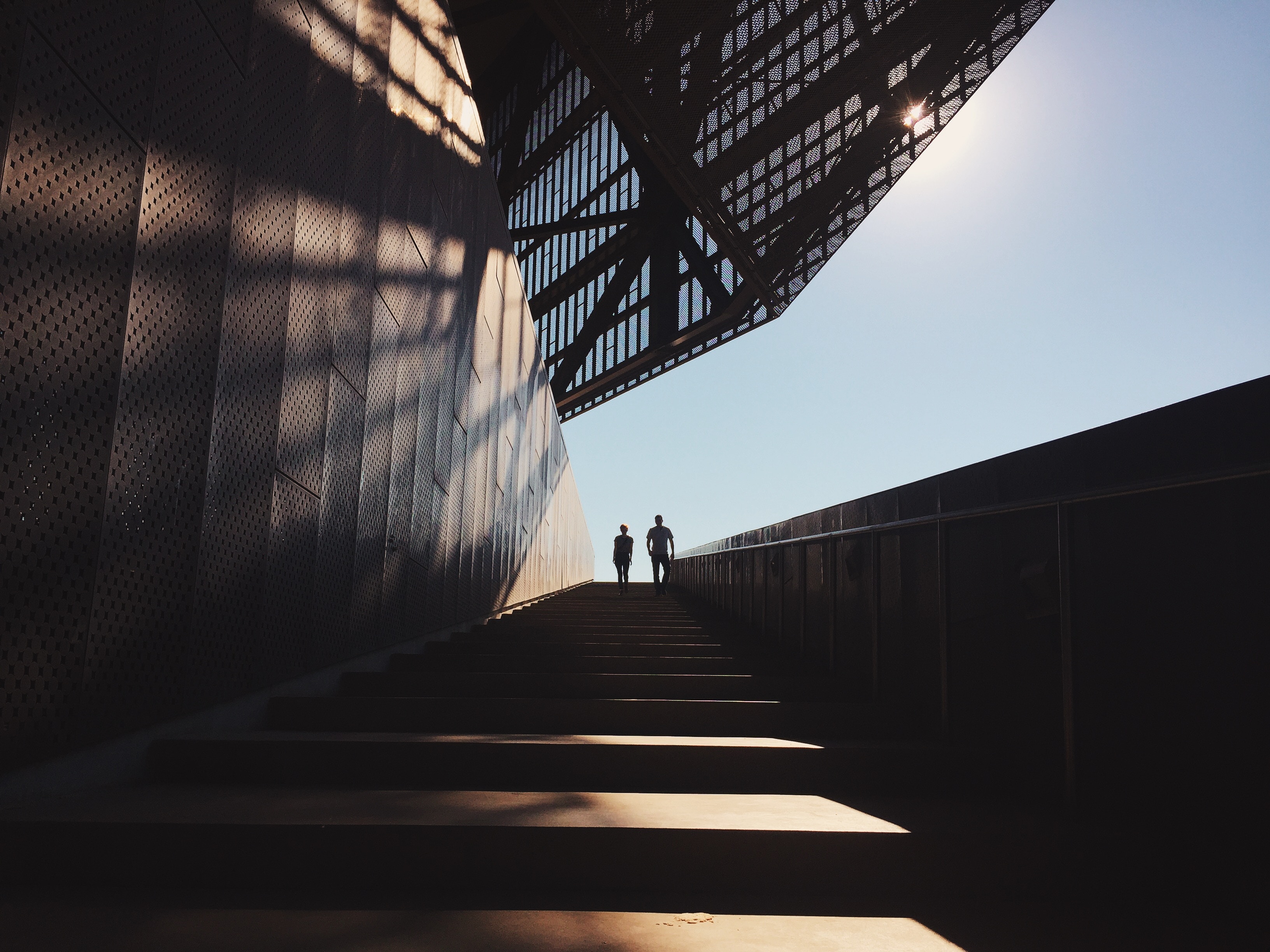 two persons in a very long staircase