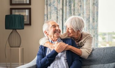 Happy independent couple in their home